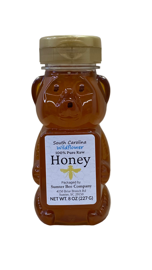 8 Oz Sumter Bee Company South Carolina honey in a Bear-shaped honey container with a label on a white background